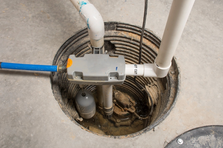 A sump pump installed in a basement of a home 