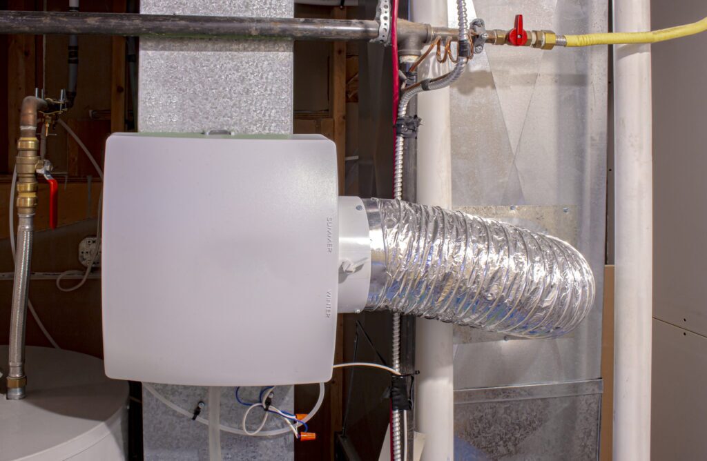 A whole-house humidifier installed on a furnace in an Omaha, NE home by Thermal Services.