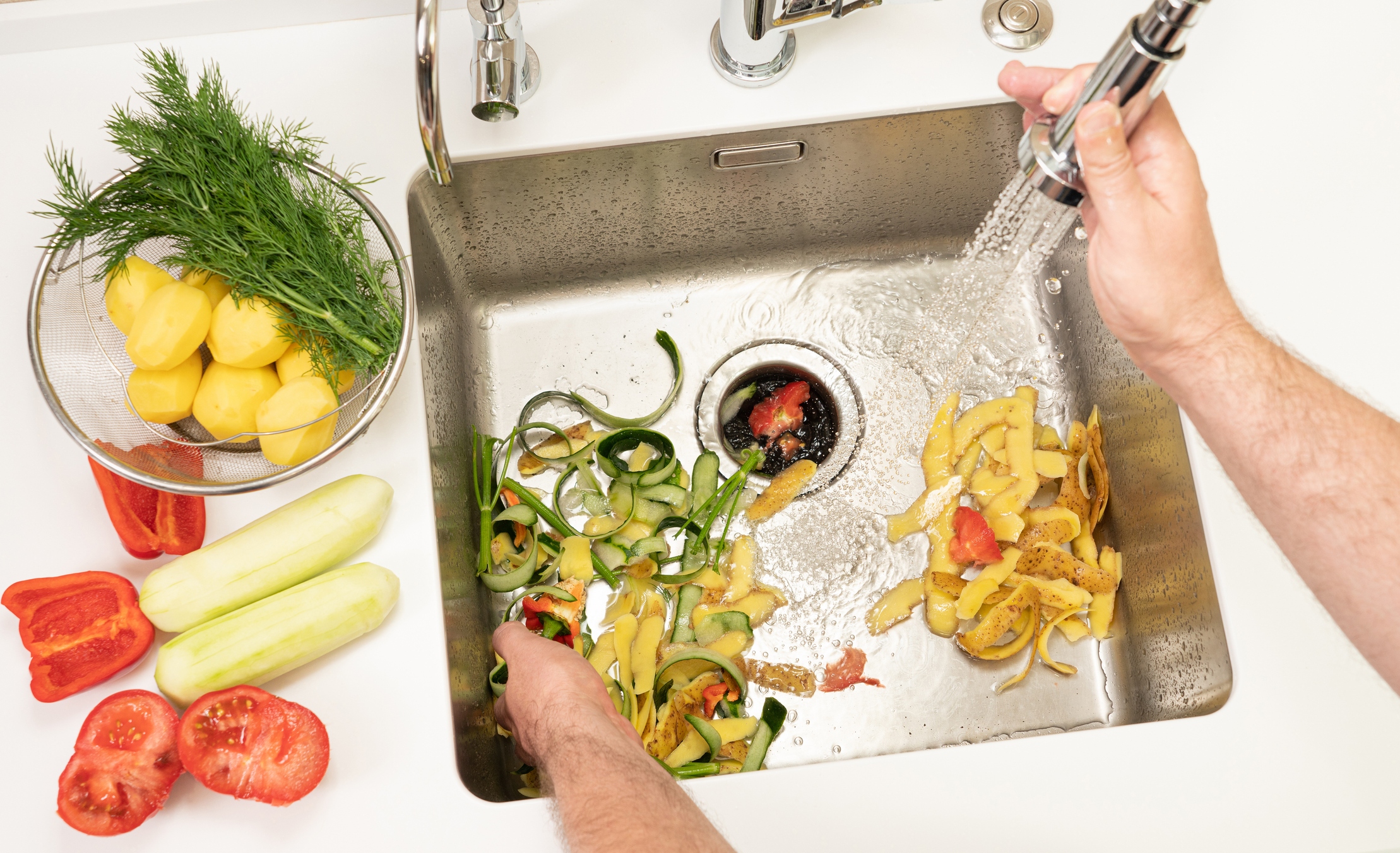 Sink with food scraps and garbage disposal tips from Thermal Services in Omaha, NE